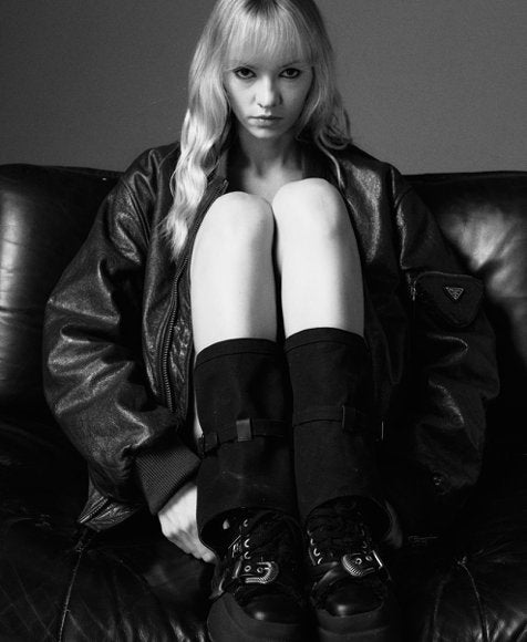 FIRSTCORNER model wearing black shoes